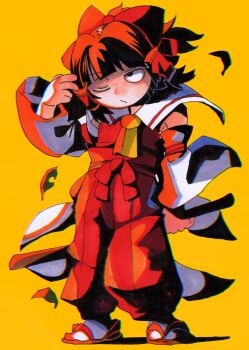 1girl arm_up ascot black_hair bow commentary_request detached_sleeves falling_leaves floating_hair full_body gohei hair_bow hair_tubes hakama hakama_pants hakurei_reimu highres holding holding_gohei inuyama_konan japanese_clothes leaf medium_hair one_eye_closed pants red_bow red_hakama red_shirt sandals shide shirt simple_background sleeveless sleeveless_shirt tabi touhou waist_bow yellow_ascot yellow_background zouri