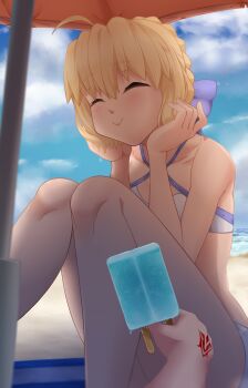 1boy 1girl absurdres ahoge artoria_pendragon_(fate) artoria_pendragon_(swimsuit_archer)_(fate) artoria_pendragon_(swimsuit_archer)_(first_ascension)_(fate) bare_shoulders beach beach_umbrella bikini blonde_hair blue_ribbon blue_sky blush braid breasts closed_eyes command_spell darkkin fate/grand_order fate_(series) food fujimaru_ritsuka_(male) hair_bun hair_ribbon highres long_hair medium_breasts popsicle pov ribbon sidelocks sitting sky smile solo_focus swimsuit thighs umbrella white_bikini