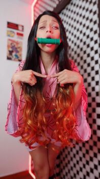 Rule 34 | 1girl, ahegao, bamboo, bare legs, black hair, blurry, blurry background, cosplay, female focus, fingers together, firegirlplay, highres, indoors, japanese clothes, kamado nezuko, kamado nezuko (cosplay), kimetsu no yaiba, kimono, looking at viewer, multicolored hair, open mouth, orange hair, photo (medium), pink eyes, pink kimono, solo, standing, venezuelan (nationality)