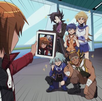 2girls 4boys blue_hair blurry blush brown_hair dark-skinned_male dark_skin depth_of_field duel_academy_uniform_(yu-gi-oh!_gx) glasses group_picture hair_between_eyes holding holding_tablet_pc long_hair long_sleeves manjoume_jun marufuji_sho multicolored_hair multiple_boys multiple_girls muscular muscular_male narcissism open_mouth p5naq_pv saotome_rei selfie selfie_prank short_hair smile sparkle tablet_pc taking_picture tenjouin_asuka two-tone_hair tyranno_kenzan v you're_doing_it_wrong yu-gi-oh! yu-gi-oh!_gx yubel yuki_judai