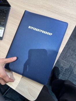 1boy chair chinese_commentary commentary_request computer highres hypergryph laptop lowlight_kirilenko original standing swivel_chair