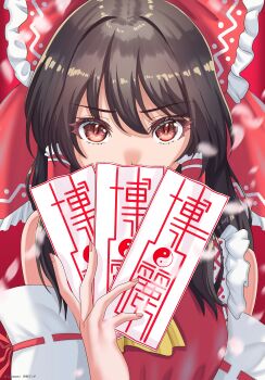 1girl absurdres ascot black_hair bow commentary_request detached_sleeves hair_bow hair_tubes hakurei_reimu highres holding japanese_clothes kenja_panda long_hair looking_at_viewer miko red_bow red_eyes solo touhou yellow_ascot
