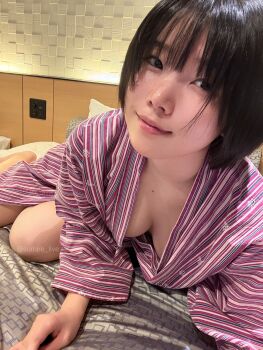 Rule 34 | 1girl, absurdres, asian, bed, bedroom, black hair, breasts, closed mouth, downblouse, highres, indoors, looking at viewer, lying, medium breasts, no bra, on bed, open clothes, real life, short hair, smile, solo, sumire live, twitter username