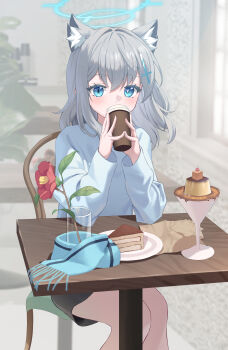 Rule 34 | 1girl, absurdres, animal ears, aworuw1137, blue archive, blue eyes, blue halo, blue scarf, blurry, blurry background, coffee, cross, cross hair ornament, dessert, flower, food, grey hair, hair ornament, halo, highres, inverted cross, mismatched pupils, scarf, shiroko (blue archive), skirt, sweater, table, wolf ears, wooden table