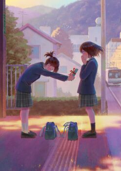 2girls bag blazer blue_jacket blush brown_hair building commentary_request evening gift green_skirt highres holding holding_gift jacket mountain multiple_girls original outdoors plaid_clothes plaid_skirt ponytail railroad_tracks school_bag school_uniform short_ponytail skirt solanoko train train_station valentine yuri