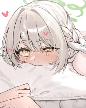 1girl absurdres blue_archive blush bow crying crying_with_eyes_open face_in_pillow green_halo grey_hair hair_between_eyes hair_bow halo heart heart-shaped_pupils highres implied_sex ka_keo long_hair miyo_(blue_archive) pillow portrait symbol-shaped_pupils tears white_bow yellow_eyes