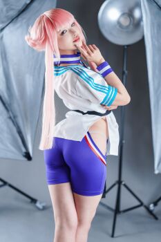 1girl absurdres ass ass_focus capcom clothing_cutout cosplay cosplay_photo dougi female_focus highres hime_cut manon_legrand manon_legrand_(cosplay) photo_(medium) pink_hair real_life short_hair short_hair_with_long_locks sidelocks solo street_fighter street_fighter_6 thighs