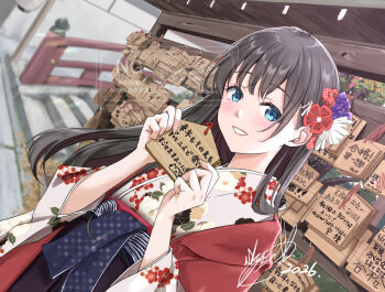 1girl 2026 black_hair blue_eyes commentary_request dated dutch_angle ema floral_print floral_print_kimono flower hair_flower hair_ornament highres holding japanese_clothes kimono long_hair looking_at_viewer nengajou new_year obi original print_kimono sash shrine smile solo soragane_(banisinngurei)