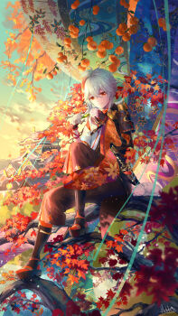 1boy antenna_hair armor bandages closed_mouth fingerless_gloves full_body genshin_impact gloves grey_hair hair_between_eyes hebbtia highres holding holding_leaf japanese_armor japanese_clothes kaedehara_kazuha leaf looking_at_viewer low_ponytail male_focus maple_leaf multicolored_hair on_tree ponytail red_eyes red_hair shoulder_armor smile sode solo streaked_hair white_hair