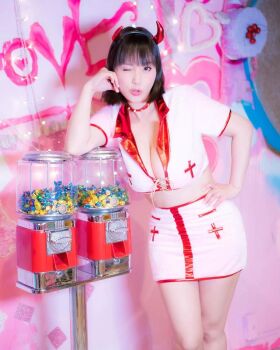 1girl breasts brown_eyes brown_hair candy collar dispenser fake_horns female_focus food highres horns large_breasts looking_at_viewer machine medium_hair model one_eye_closed photo_(medium) real_life shibuya_kaho solo