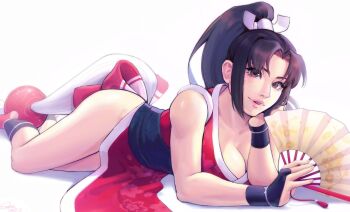 1girl breasts brown_hair cleavage fatal_fury hand_fan highres large_breasts long_hair looking_at_viewer lying ninja on_stomach pelvic_curtain shiranui_mai the_king_of_fighters white_background xiowu007