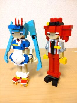 Rule 34 | 2girls, alternate costume, apron, arms at sides, black footwear, black necktie, blue dress, blue eyes, blue hair, bow, choroli (chorolin), dress, drill hair, full body, grey shirt, hair bow, hat, hatsune miku, highres, kasane teto, lego (medium), long hair, mesmerizer (vocaloid), multiple girls, necktie, pants, puffy short sleeves, puffy sleeves, red eyes, red footwear, red hair, red hat, red pants, roller skates, shirt, shoes, short dress, short sleeves, skates, sleeves rolled up, socks, standing, striped bow, suspenders, twin drills, twintails, unconventional media, very long hair, vocaloid, white apron, white socks