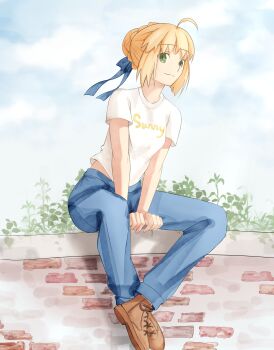 1girl absurdres ahoge alternate_costume andychen662000 artoria_pendragon_(fate) blonde_hair bow braid brick_wall bun_with_braided_base casual clothes_writing cloud cloudy_sky denim english_text fate/stay_night fate_(series) green_eyes hair_bow hair_bun highres jeans outdoors pants plant saber_(fate) shirt sidelocks sky solo t-shirt