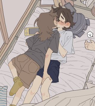 1other 2girls androgynous backpack bag black_shorts blush brown_hair brown_shorts charging_device closed_eyes commentary_request controller dayama ear_blush game_controller grey_shirt hand_on_another's_leg highres kiss long_hair multiple_girls original shirt short_hair short_sleeves shorts sweat yuri