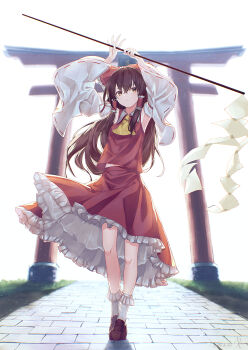 1girl absurdres arms_up ascot bobby_socks bow brown_eyes brown_hair brown_shoes commentary detached_sleeves frilled_bow frilled_hair_tubes frilled_skirt frilled_socks frills full_body gohei hair_bow hair_tubes hakurei_reimu highres holding holding_gohei kisamu_(ksmz) loafers long_hair looking_at_viewer midriff_peek nontraditional_miko outdoors path red_bow red_skirt ribbon-trimmed_sleeves ribbon_trim road shoes sidelocks skirt skirt_set socks solo temple_gate torii touhou white_sleeves white_socks wide_sleeves yellow_ascot