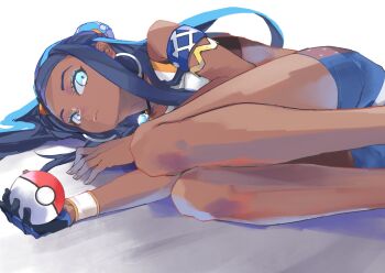 1girl bare_legs black_hair blue_eyes blue_eyeshadow blue_hair closed_mouth dark-skinned_female dark_skin earrings eyelashes eyeshadow feet_out_of_frame fetal_position gloves hair_bun hair_spread_out highres holding holding_poke_ball hoop_earrings jewelry kiriyama legs_together looking_at_viewer lying makeup multicolored_hair nessa_(pokemon) nintendo nose on_side poke_ball poke_ball_(basic) pokemon pokemon_swsh single_glove single_hair_bun solo two-tone_hair