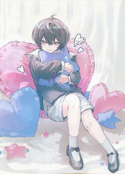 1boy aged_down black_hair black_shirt black_shoes blue_pillow blush bow child commentary doodled_object ensemble_stars! footwear_bow full_body hair_between_eyes heart heart-shaped_pillow highres holding holding_pillow librilesser male_focus pillow pink_pillow purple_bow red_eyes sakuma_ritsu shirt shoes shorts sitting smile socks star-shaped_pillow white_shorts white_socks
