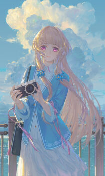 1girl absurdres ame_(2453323719) backlighting bag blonde_hair blue_jacket camera cloud cloudy_sky commentary_request dress flower_hairpin frilled_dress frills handbag highres holding holding_camera jacket long_hair looking_at_viewer ocean original purple_eyes railing sky sleeve_ribbon smile solo very_long_hair white_dress wide_sleeves