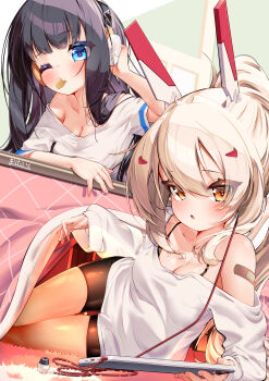 1girl 2girls absurdres ayanami_(azur_lane) azur_lane black_hair blue_eyes breasts cleavage commentary_request headgear headphones highres kotatsu long_hair long_island_(azur_lane) marimo_daifuku medium_breasts mouth_hold multiple_girls one_eye_closed ponytail shirt table white_shirt