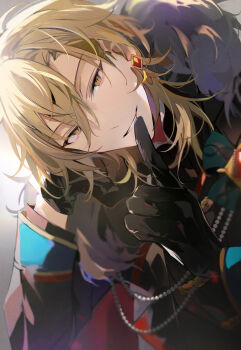 1boy arm_support backlighting beads black_coat black_gloves black_jacket blonde_hair blurry blurry_foreground coat collared_coat commentary_request curtained_hair double-parted_bangs dutch_angle earrings ensemble_stars! finger_to_mouth fur_shawl gem gloves grin hair_between_eyes hakaze_kaoru hand_on_own_cheek hand_on_own_face high_collar highres jacket jewelry kaoso looking_at_viewer male_focus medium_hair official_alternate_costume parted_lips red_gem shawl shushing sleeve_cuffs smile solo stud_earrings v-shaped_eyebrows wolf_cut yellow_eyes