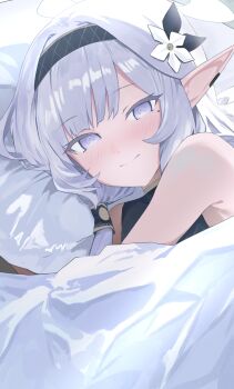 1girl absurdres black_hairband blue_archive blush closed_mouth commentary_request earclip evening_rabbit flower hair_flower hair_ornament hair_tubes hairband halo head_on_pillow highres himari_(blue_archive) long_hair looking_at_viewer lying mole mole_under_eye pillow pointy_ears purple_eyes smile solo under_covers white_hair white_halo