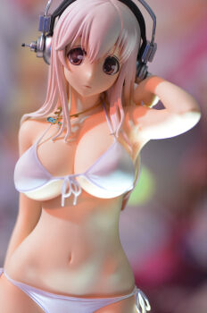 1girl bare_shoulders bikini breasts cleavage female_focus figure figure_(medium) front-tie_top headphones highres jewelry large_breasts long_hair navel necklace nitroplus parted_lips photo_(medium) pink_eyes pink_hair reference_photo reference_work side-tie_bikini_bottom solo super_sonico swimsuit tucking_hair underboob upper_body white_bikini