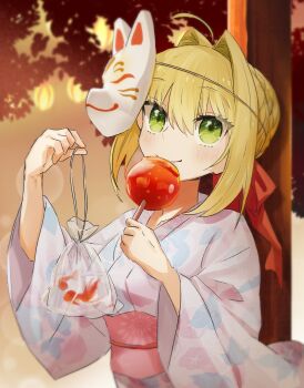 1girl ahoge bag bagged_fish blonde_hair braid braided_base bun_with_braided_base candy_apple commentary_request fate_(series) fish floral_print floral_print_kimono food fox_mask goldfish green_eyes hair_bun hair_intakes hair_ribbon highres holding holding_food japanese_clothes kimono lantern mask mask_on_head nero_claudius_(fate) print_kimono red_ribbon ribbon single_hair_bun smile solo upper_body wide_sleeves yukata zhang5180