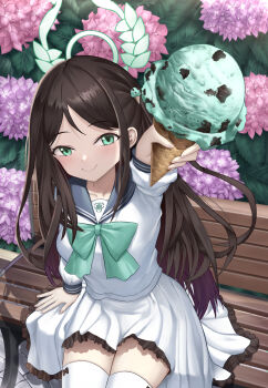 1girl absurdres airi_(blue_archive) arm_at_side bench black_sailor_collar blue_archive blush bow bow_legwear bowtie brown_bow brown_hair c: closed_mouth commentary cowboy_shot dating day eyelashes fingernails floating_hair flower food-themed_hair_ornament foreshortening frilled_skirt frills green_bow green_bowtie green_eyes green_halo gyeonyu_art hair_ornament halo hand_up highres holding holding_ice_cream_cone hydrangea ice_cream_cone ice_cream_hair_ornament incoming_food long_hair long_sleeves looking_at_viewer mint_chocolate on_bench outdoors park_bench parted_bangs pink_flower pleated_skirt pov purple_flower sailor_collar school_uniform serafuku shirt sidelocks sitting skirt smile solo sunlight thighhighs trinity_general_school_logo very_long_hair white_serafuku white_shirt white_skirt white_thighhighs zettai_ryouiki