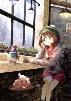 1girl alcremie bob_cut brown_eyes brown_hair cafe cardigan cup dress gen_8_pokemon gloria_(pokemon) green_hat green_socks grey_cardigan hand_on_own_face hat highres holding holding_cup hood hooded_cardigan nintendo open_mouth pink_dress plaid_clothes plaid_socks pokemon pokemon_swsh ribero short_hair sinistea socks tam_o&#039;_shanter