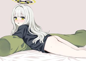 1girl ass black_shirt blue_archive blush body_pillow bottomless butt_crack clothes_lift green_eyes grey_background hair_intakes halo hare_(blue_archive) hare_(pajamas)_(blue_archive) kumadano loli long_hair looking_back lying naked_shirt on_stomach open_mouth oversized_clothes oversized_shirt pillow shirt shirt_lift solo sweat t-shirt white_hair