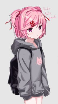 1girl alternate_costume animal_print backpack bag black_bag casual cat_print character_name closed_mouth commentary cowboy_shot doki_doki_literature_club english_commentary grey_background grey_hoodie hair_intakes hair_ornament hair_ribbon hairclip highres hood hood_down hoodie jinzzzzzzzz0222 long_sleeves natsuki_(doki_doki_literature_club) pink_eyes pink_hair red_ribbon ribbon short_hair simple_background sleeves_past_fingers sleeves_past_wrists solo third-party_source two_side_up