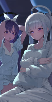 2girls absurdres animal_print arms_up blue_archive blue_pajamas blunt_bangs blush breasts cat_print cleavage collarbone commentary_request film_grain grey_hair grey_pajamas hair_tie hair_tie_in_mouth halo highres holding holding_pillow hugging_object light_smile long_hair long_sidelocks long_sleeves looking_at_viewer mechanical_halo mouth_hold multiple_girls noa_(blue_archive) noa_(pajamas)_(blue_archive) pajamas pillow ponytail print_pajamas purple_eyes purple_hair short_sleeves sidelocks sirong_e tying_hair yuuka_(blue_archive) yuuka_(pajamas)_(blue_archive)