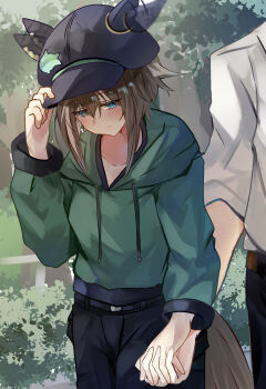 1boy 1girl absurdres afterimage animal_ears belt bimmy black_pants blue_eyes blush brown_hair cheval_grand_(casual)_(umamusume) cheval_grand_(umamusume) closed_mouth collarbone drawstring ear_covers ears_through_headwear ears_wagging fish_hat_ornament green_hoodie hair_between_eyes hat highres holding_hands hood hood_down hoodie horse_ears horse_girl horse_tail long_sleeves looking_down multicolored_hair outdoors pants shirt streaked_hair tail umamusume white_hair white_shirt