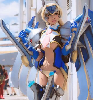 1girl arc_system_works armor asian bikini_armor blazblue blazblue:_continuum_shift blonde_hair blue_eyes breasts cosplay cosplay_photo cyborg fantastic_nami highres long_hair mecha_musume medium_breasts mu-12 mu-12_(cosplay) noel_vermillion noel_vermillion_(cosplay) photo_(medium) real_life revealing_clothes sword sword_wings underboob weapon
