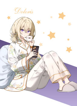 1girl alternate_costume alternate_hairstyle bang_dream! blonde_hair cellphone chinese_commentary commentary_request cup english_text full_body hair_between_eyes highres holding holding_phone knees_up long_sleeves looking_at_viewer migolu misumi_uika pajamas pants phone pillow purple_eyes sitting slippers smartphone solo star_(symbol) white_pants