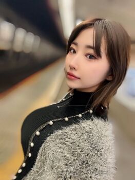 1girl black_sweater blurry blurry_background breasts from_side highres indoors japanese_(nationality) large_breasts lipstick makeup matsumoto_nanami photo_(medium) short_hair standing subway sweater