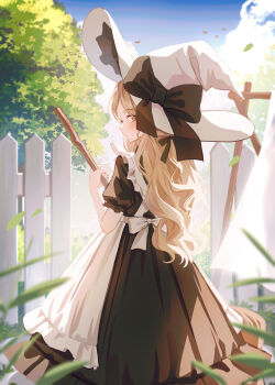 1girl absurdres apron back_bow black_bow black_dress blonde_hair blue_sky blush bow broom brown_eyes closed_mouth day dress feet_out_of_frame fence garden hat hat_bow highres holding holding_broom inosia large_bow long_hair looking_at_viewer looking_back original outdoors sky standing tree wavy_hair white_apron white_hat witch_hat