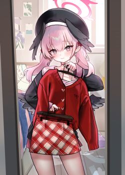 1girl absurdres black_hat black_shirt black_wings blue_archive blush cardigan closed_mouth commentary_request hair_between_eyes hat head_wings highres holding holding_unworn_clothes hyurumari koharu_(blue_archive) korean_commentary long_hair looking_at_mirror low_wings mirror pencil_skirt pink_eyes pink_hair pink_sailor_collar pink_skirt plaid_clothes plaid_skirt red_cardigan red_skirt reflection sailor_collar shirt skirt smile solo twintails wings