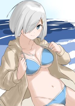 1girl 30-06 bikini blue_bikini blue_eyes breasts brown_jacket grey_hair hair_ornament hair_over_one_eye hairclip hamakaze_(kancolle) highres jacket kantai_collection large_breasts looking_at_viewer navel ocean open_clothes open_jacket outdoors short_hair solo swimsuit water