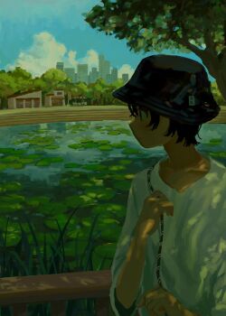 1girl black_hair black_hat bucket_hat building cloud dappled_sunlight day from_side hat highres lily_pad oimoti_tn original outdoors pond profile scenery shirt short_hair skyline solo sunlight tree water white_shirt