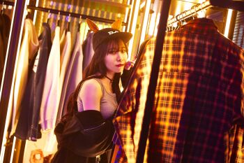 1girl absurdres black_cap breasts hanger highres machikane_tanhoiza medium_breasts photo_(medium) toono_hikaru umamusume