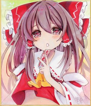 Rule 34 | 1girl, ascot, bare shoulders, blush, bow, brown eyes, brown hair, commentary request, detached sleeves, frilled bow, frilled hair tubes, frills, hair between eyes, hair bow, hair tubes, hakurei reimu, hand up, highres, holding, holding ofuda, hoshi tea party, long hair, long sleeves, looking at viewer, midriff, navel, nontraditional miko, ofuda, parted lips, photo (medium), red bow, red shirt, ribbon-trimmed sleeves, ribbon trim, shirt, signature, sleeveless, sleeveless shirt, solo, touhou, traditional media, upper body, wide sleeves, yellow ascot