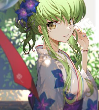 1girl blurry blurry_background bracelet c.c. code_geass commentary creayus floral_print flower from_side green_hair hair_flower hair_ornament hand_up japanese_clothes jewelry kimono looking_at_viewer looking_to_the_side multicolored_nails obi parted_lips ponytail sash short_ponytail sidelocks smile solo symbol-only_commentary upper_body wavy_hair yellow_eyes