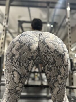 1girl asian ass ass_focus black_hair curvy exercising gym_uniform hair_bun highres huge_ass japanese_(nationality) long_hair pants photo_(medium) real_life ririkana simple_background skin_tight skindentation solo thigh_gap training weights wide_hips yoga_pants