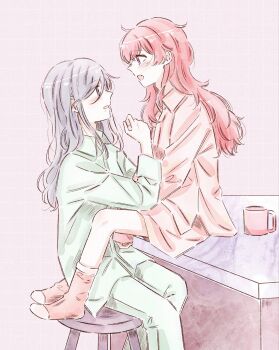 Rule 34 | 2girls, 6ccb20, blue eyes, coffee mug, collared shirt, commentary, cup, fang, green pants, green shirt, highres, hinomori shizuku, mole, mole under mouth, momoi airi, mug, multiple girls, open mouth, pants, pink background, pink eyes, pink hair, pink shirt, pink socks, project sekai, shirt, simple background, smile, socks, untranslatable commentary, yuri