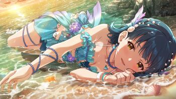 1girl beach bikini blue_bikini blue_hair blush bracelet breasts cleavage commentary_request game_cg hair_ornament idolmaster idolmaster_million_live! idolmaster_million_live!_theater_days jewelry looking_at_viewer lying nanao_yuriko necklace official_alternate_costume official_alternate_hairstyle official_art on_side outdoors shell short_hair solo starfish sunset swimsuit third-party_source water yellow_eyes
