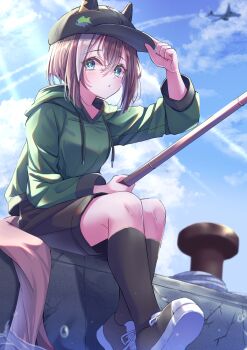 1girl aircraft airplane animal_ears black_hat black_shoes black_shorts black_socks blue_eyes brown_hair cheval_grand_(casual)_(umamusume) cheval_grand_(umamusume) cloud commentary_request day drawstring ears_through_headwear fishing fishing_rod green_hoodie hair_between_eyes hand_on_headwear hat highres holding holding_fishing_rod hood hoodie horse_ears horse_girl horse_tail kneehighs long_sleeves looking_at_viewer multicolored_hair outdoors shoes short_hair_with_long_locks shorts sitting socks solo streaked_hair sunlight tail takenaka_takeshi umamusume white_hair