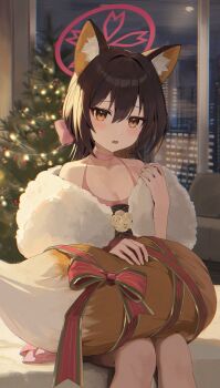 1girl animal_ear_fluff animal_ears blue_archive bow brown_eyes brown_hair christmas_lights christmas_tree cityscape commentary_request dress fangs fox_ears fox_tail halo hand_up highres holding_own_tail indoors izuna_(blue_archive) izuna_(dress)_(blue_archive) knees looking_at_viewer night on_bed parted_lips pink_bow pink_dress reflection ribbon sitting solo stole tail tail_on_lap tem_(tempainting1) window