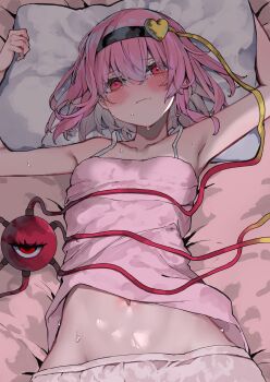 1girl absurdres black_hairband blush camisole flat_chest hair_ornament hairband head_on_pillow heart heart_hair_ornament highres kararage_tsune komeiji_satori looking_at_viewer navel on_bed pillow pillow_grab pink_camisole pink_hair red_eyes short_hair solo spaghetti_strap stomach sweatdrop third_eye touhou