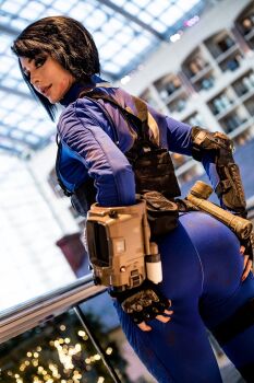 1girl ass bodysuit cosplay fallout fallout_4 highres jenna_lynn_meowri photo_(medium) real_life vault_meat